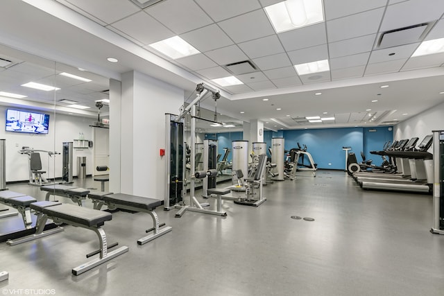 gym featuring a paneled ceiling