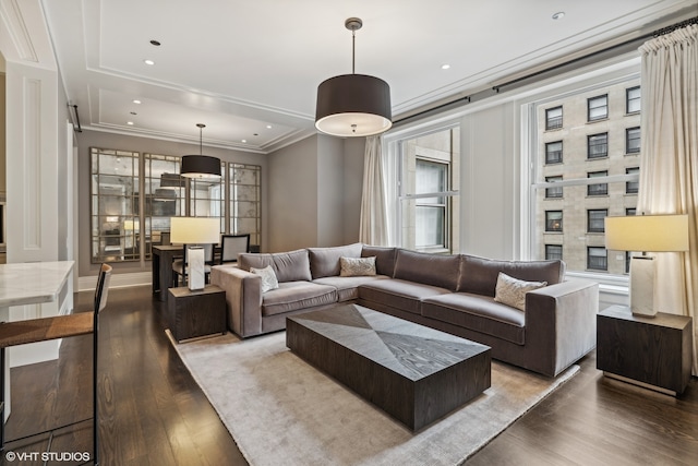 living room featuring ornamental molding, hardwood / wood-style flooring, and a wealth of natural light