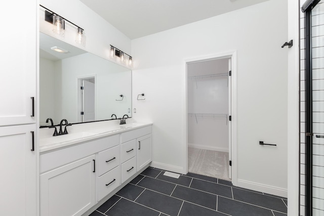 bathroom with tile patterned flooring and vanity