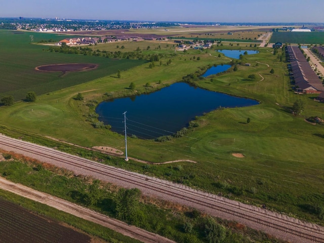 aerial view with a rural view and a water view