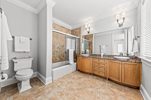 full bathroom featuring vanity, toilet, ornamental molding, and enclosed tub / shower combo