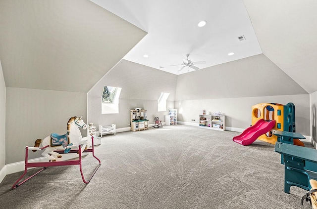 game room featuring carpet flooring, ceiling fan, and vaulted ceiling