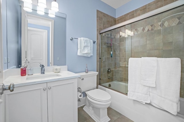 full bathroom with tile patterned flooring, vanity, enclosed tub / shower combo, and toilet