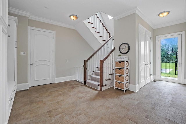 foyer featuring crown molding