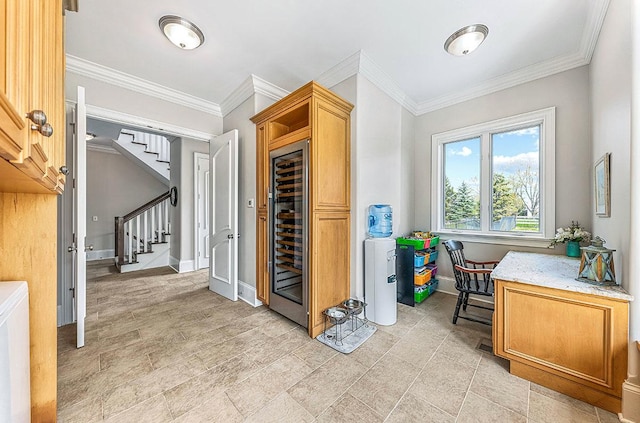 interior space featuring ornamental molding and wine cooler