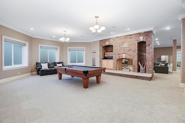 playroom featuring pool table, a brick fireplace, plenty of natural light, light colored carpet, and ornamental molding