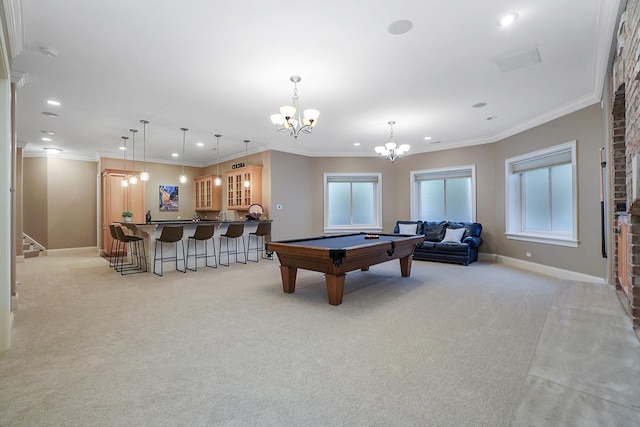 rec room featuring a healthy amount of sunlight, a notable chandelier, billiards, crown molding, and light colored carpet