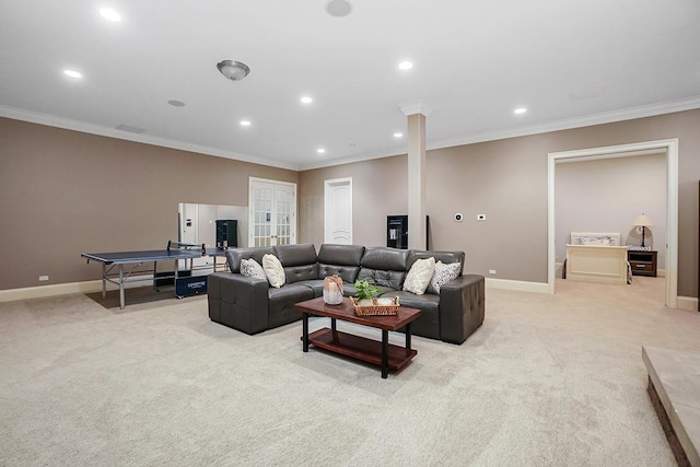 living room featuring ornamental molding and light carpet