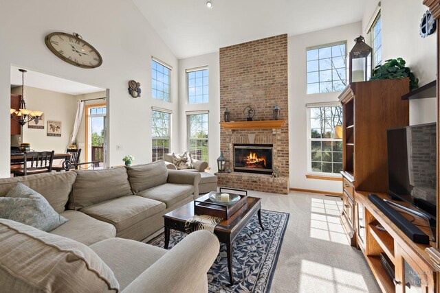 730 Fenview Cir, Algonquin, IL 60102 - living room with high vaulted ceiling, plenty of natural light, a fireplace, light colored carpet, and a chandelier