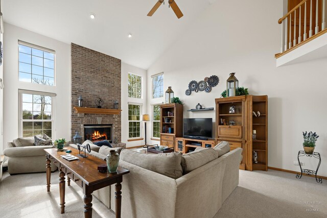 730 Fenview Cir, Algonquin, IL 60102 - living room featuring high vaulted ceiling, light carpet, a fireplace, ceiling fan, and baseboards