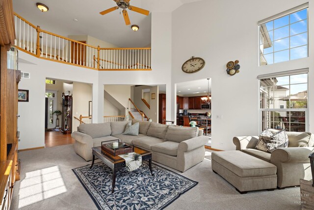 730 Fenview Cir, Algonquin, IL 60102 - living area with ceiling fan, a towering ceiling, plenty of natural light, light carpet, and stairway