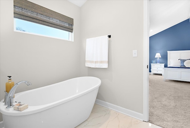 bathroom with tile floors and a tub