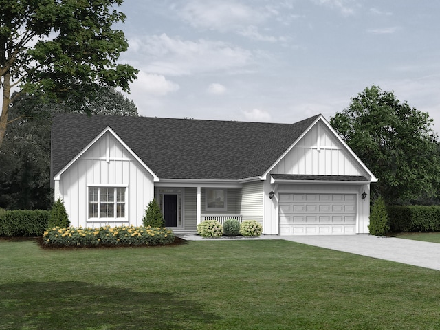 view of front of home with a front yard and a garage