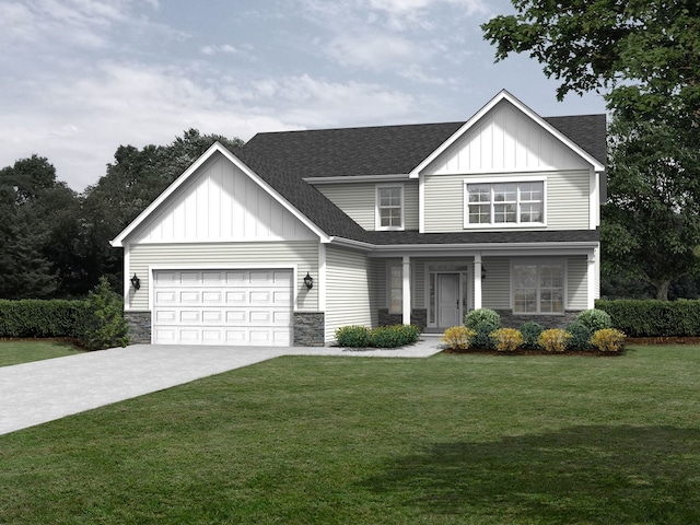 view of front of property featuring a front yard and a garage