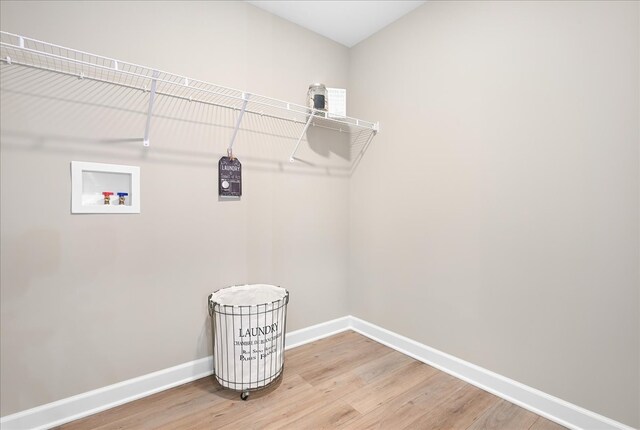 washroom featuring washer hookup and light wood-type flooring