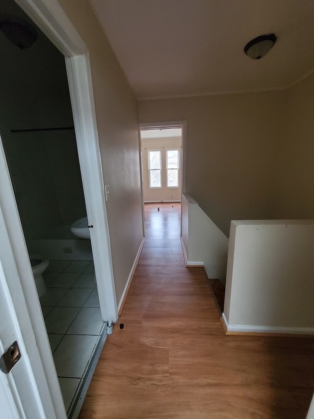 hallway featuring light tile floors