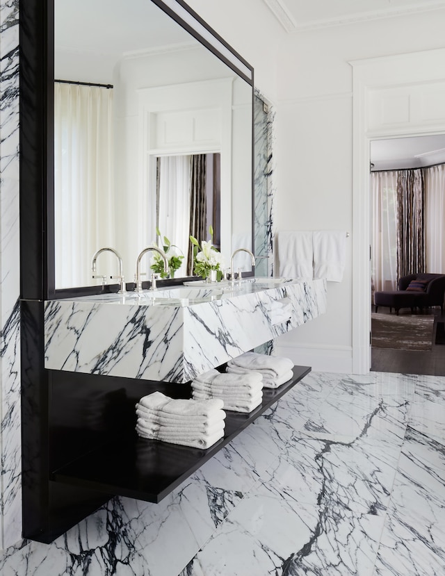 miscellaneous room featuring tile floors and ornamental molding