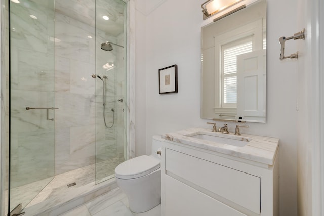 bathroom with walk in shower, tile floors, toilet, and vanity with extensive cabinet space