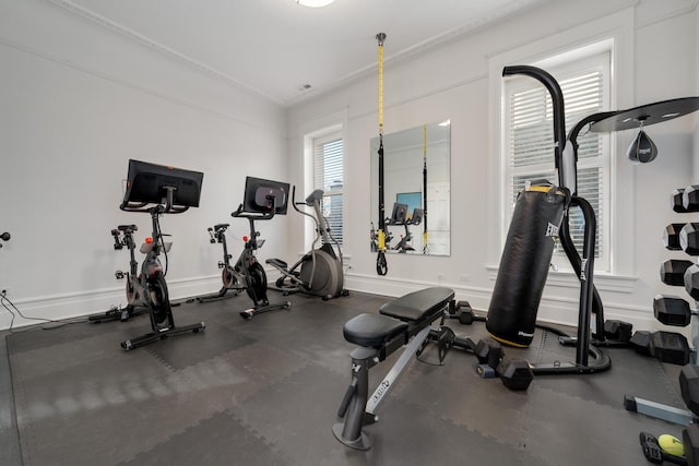 workout area with ornamental molding