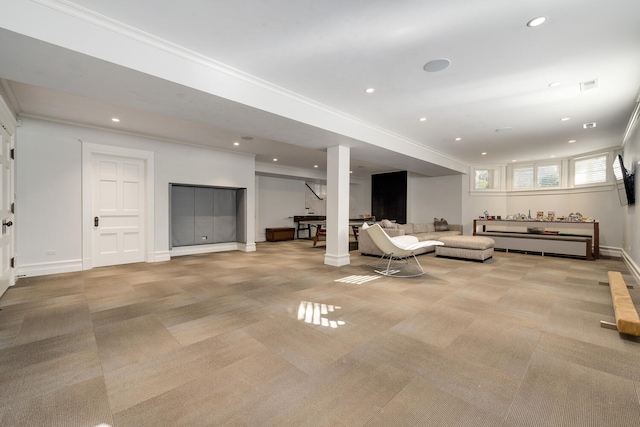 living room with light colored carpet and decorative columns