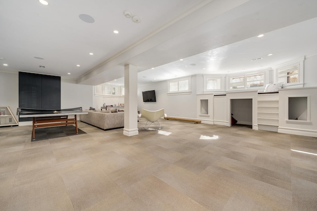 living room featuring light carpet and crown molding