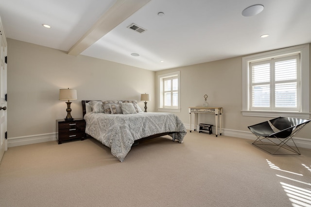 carpeted bedroom featuring beamed ceiling and multiple windows