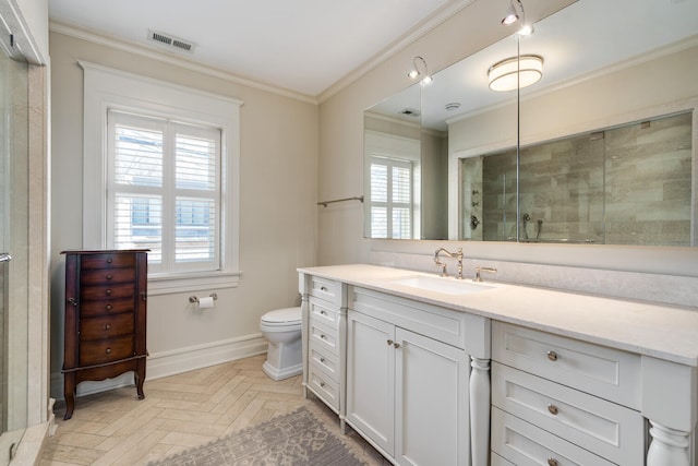 bathroom featuring a shower with shower door, parquet floors, toilet, vanity, and crown molding