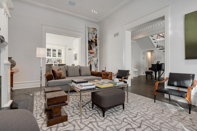 living room featuring crown molding and light wood-type flooring