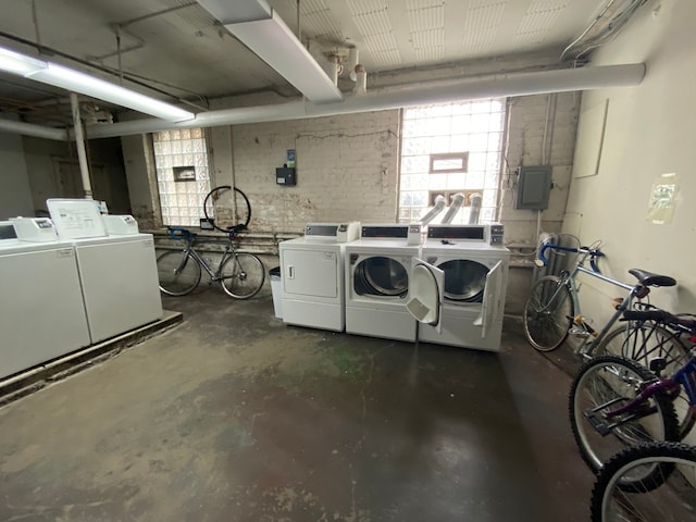 washroom with independent washer and dryer