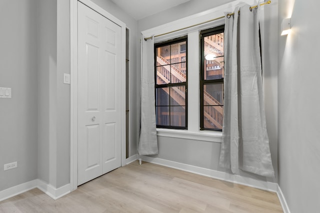 spare room with light wood-type flooring