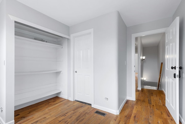 interior space featuring a closet and wood-type flooring