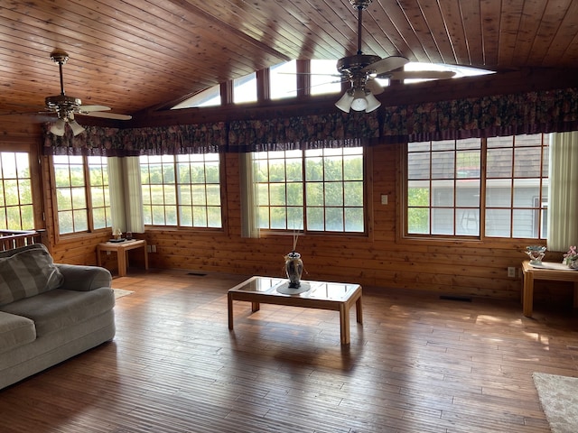 living room with wooden ceiling, ceiling fan, dark wood-type flooring, and a healthy amount of sunlight