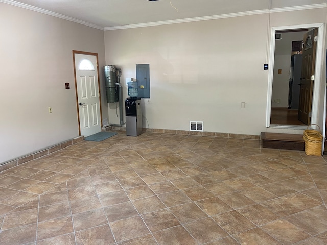 tiled empty room featuring crown molding