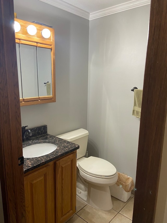 bathroom featuring toilet, tile floors, oversized vanity, and crown molding