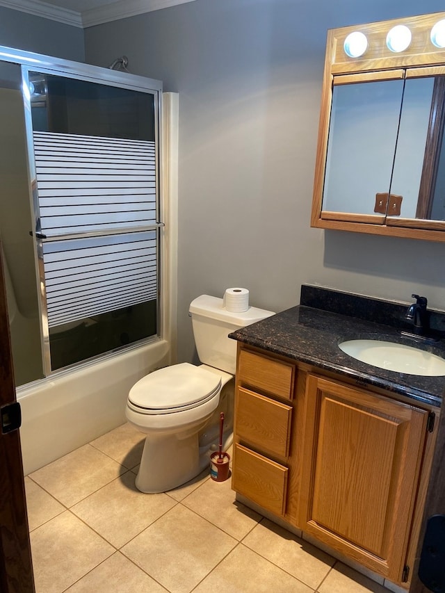 full bathroom with toilet, vanity, enclosed tub / shower combo, crown molding, and tile floors