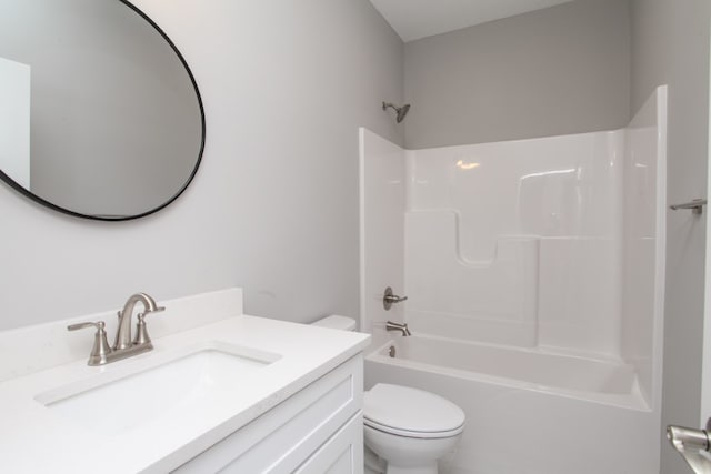 full bathroom featuring toilet, large vanity, and shower / tub combination