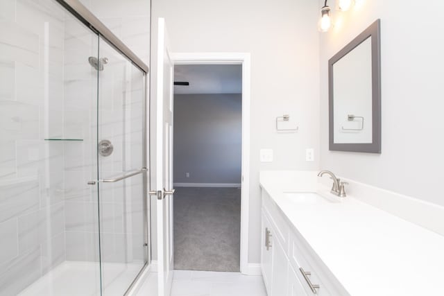 bathroom featuring tile flooring and vanity with extensive cabinet space