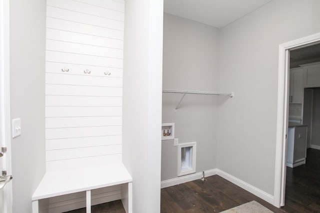 washroom featuring hookup for a washing machine and dark hardwood / wood-style flooring