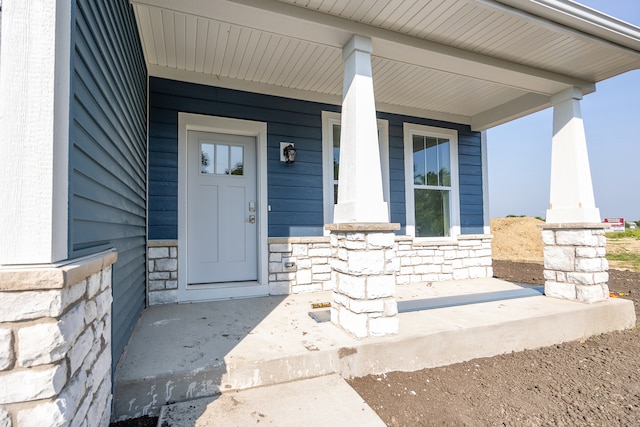 property entrance featuring covered porch