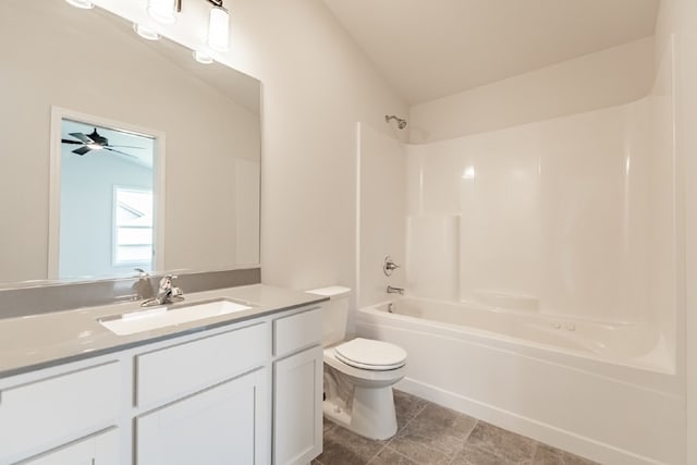 bathroom featuring toilet,  shower combination, and vanity