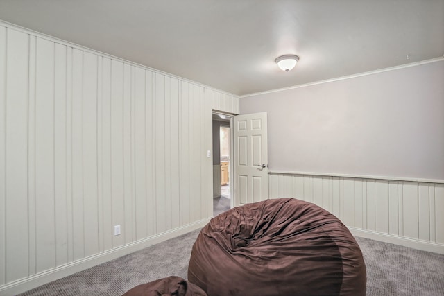 carpeted bedroom featuring ornamental molding