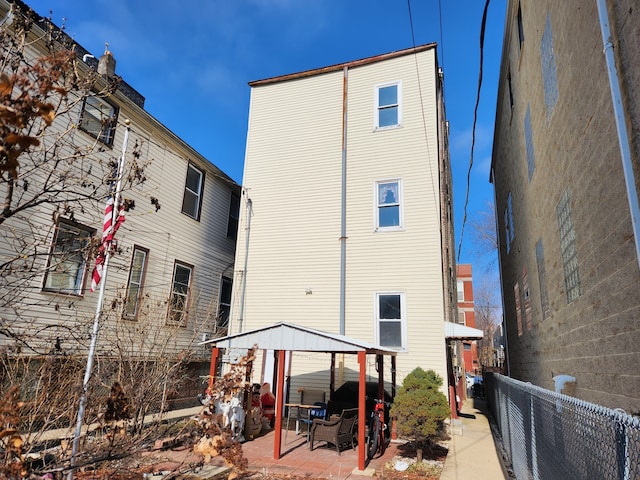 rear view of property featuring a patio