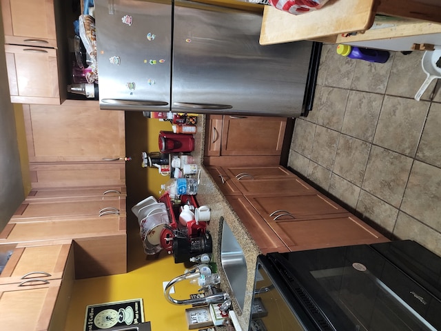 kitchen featuring tile walls