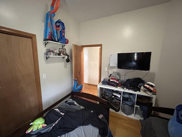 bedroom with wood finished floors