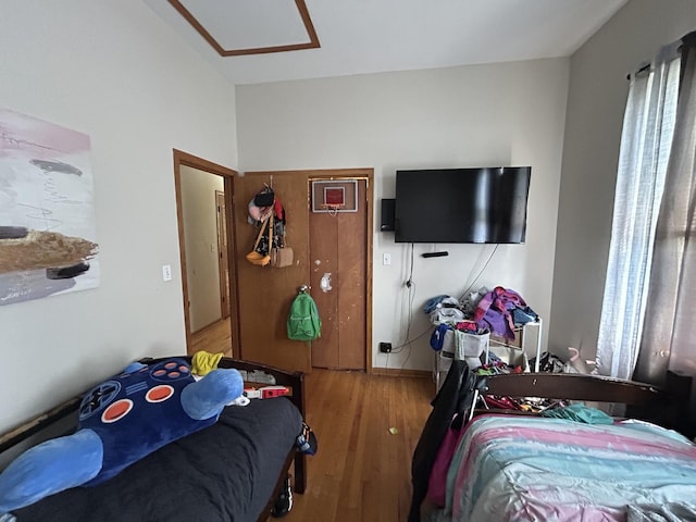 bedroom with wood finished floors