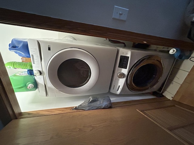 clothes washing area with independent washer and dryer and laundry area