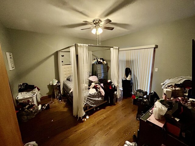 bedroom featuring a ceiling fan and wood finished floors
