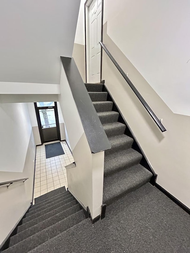 stairs with carpet flooring