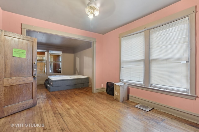 bedroom featuring light hardwood / wood-style flooring and ceiling fan