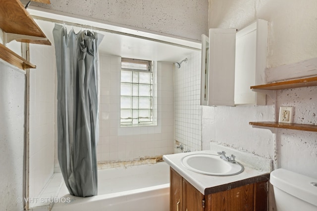 full bathroom featuring toilet, vanity, and shower / bath combo with shower curtain